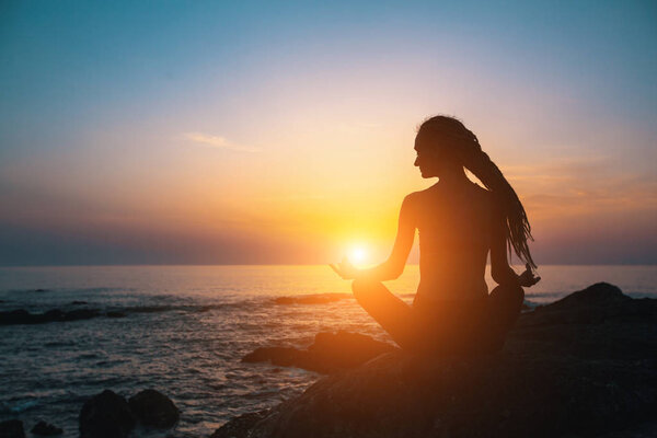 Meditation woman on ocean