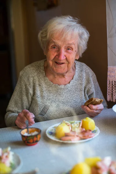 Elderly woman dinning — Stock Photo, Image