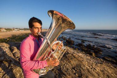 Musician play to tuba clipart
