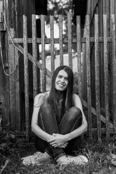 Girl near the wooden fence — Stock Photo, Image