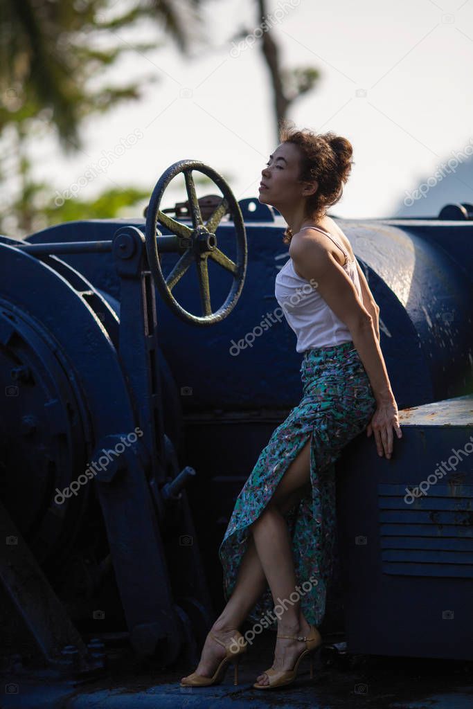 Asian woman in abandoned giant ship in jungle of Thailand (posing for a photoshoot)