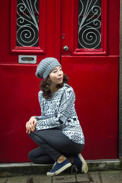 Beautiful asian woman on a street in old town.