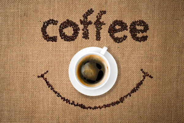 Sourire café avec tasse de café — Photo