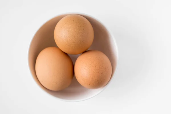 Eggs in white cup — Stock Photo, Image