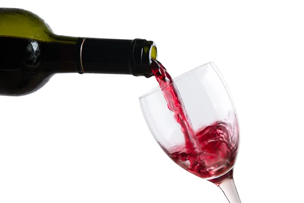 Pour red wine in glass Stock Photo