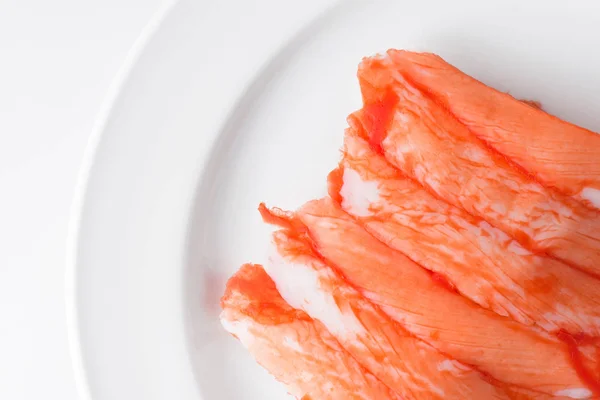 Crab stick on white plate — Stock Photo, Image