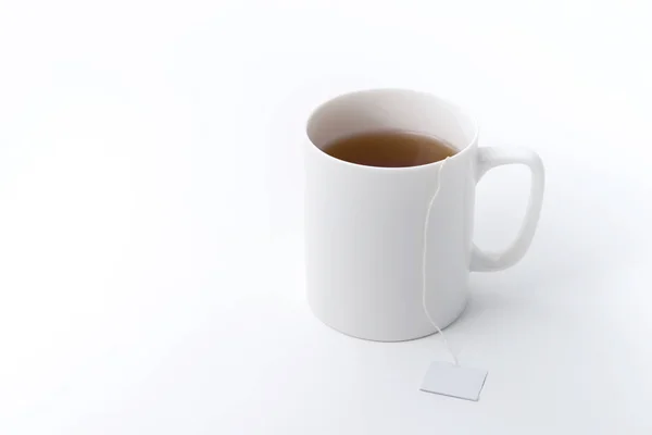 お茶の袋でティーカップ — ストック写真