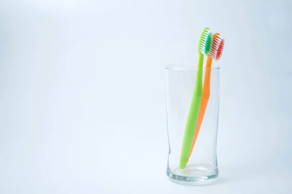 Toothbrushes in glass — Stock Photo, Image