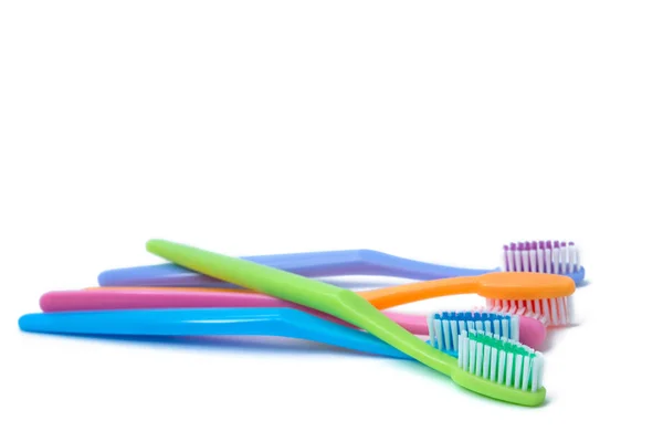 Colorful toothbrushes isolated on white — Stock Photo, Image