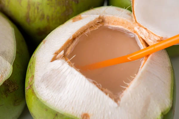 Open fresh coconut with straw — Stock Photo, Image