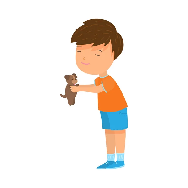 Мальчик держит своего коричневого щенка в руках векторные иллюстрации — стоковый вектор
