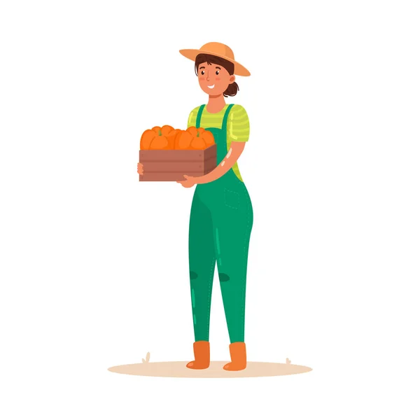 Девушка-фермер держит деревянную коробку с овощами. Векторная иллюстрация в плоском стиле мультфильма . — стоковый вектор