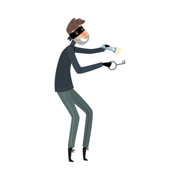 Thief in black clothes standing with the flashlight and master key in hands. Vector illustration in flat cartoon style. — Stockvector