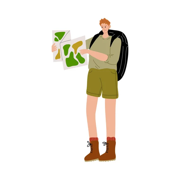 Hombre viajero con mochila de pie y mirando el mapa — Vector de stock