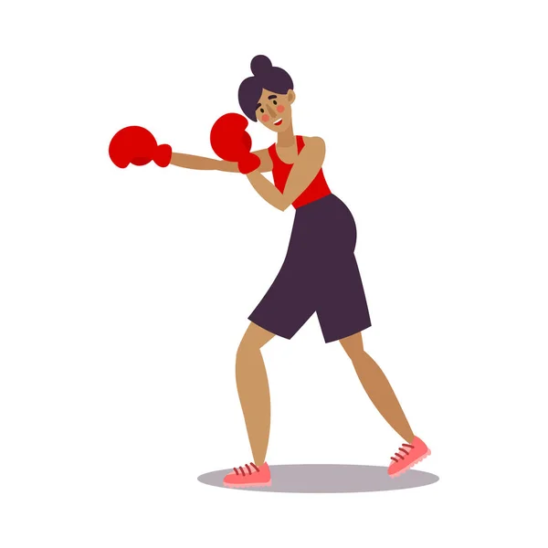 Boxeadora divertida posando en pantalones cortos negros con guantes de boxeo rojos. Ilustración vectorial en el estilo plano de dibujos animados — Archivo Imágenes Vectoriales