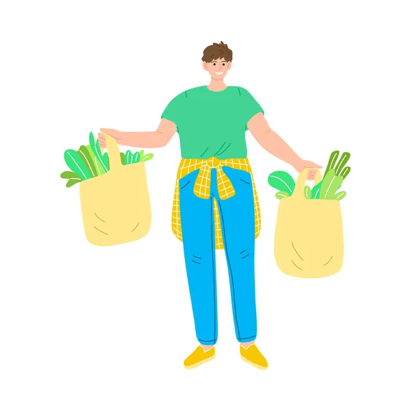 Счастливый улыбающийся мужчина в зеленой футболке, стоящий с пакетами свежей вегетарианской еды. Векторная иллюстрация в стиле мультфильма . — стоковый вектор