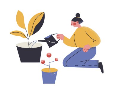 Ev bitkilerini sulayan ve koronavirüs salgını sırasında evde kalan bir kız.