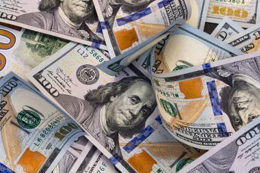 randomly layed 100 dollar bills background