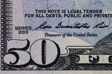50 dolarlık banknotun parçası.