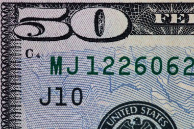 50 dolarlık banknotun parçası.