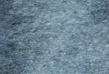 Gri arka plan hissetti. Keçenin dokusu. yün kumaş.