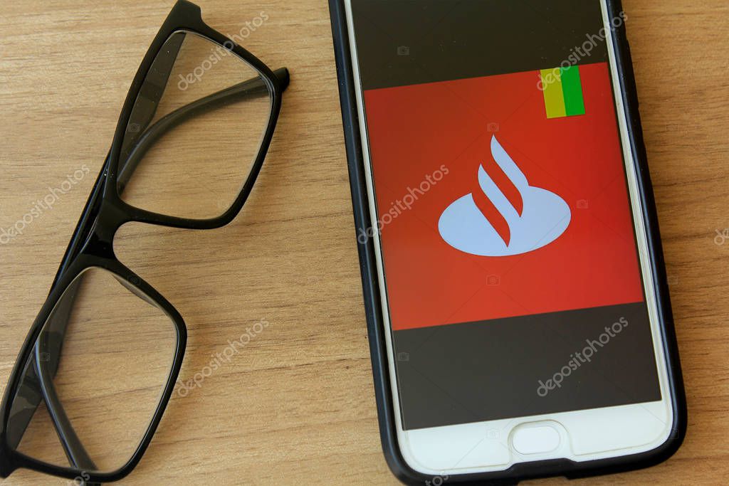 RIO DE JANEIRO, BRAZIL - DECEMBER 22, 2019: Banco Santander Brazil logo on mobile screen. It is a global banking group, originated in Santander, Cantabria, Spain.