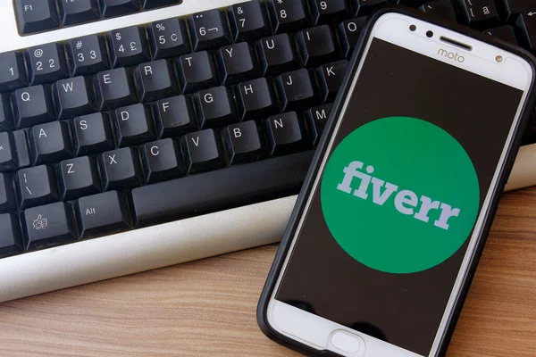 Rio de Janeiro, Brazil - February 14, 2020: Logo Fiverr on the smartphone screen Moto G5s Plus. It is a global company that offers services from five dollars