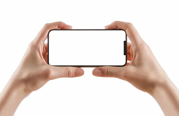 Hands holding black smartphone on white clipping path inside — Stock Photo, Image