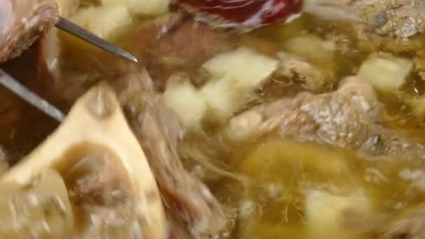 Boiling Beef Stock Top View Closeup — Stock Video