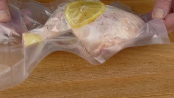 Putting Vacuum Packed Raw Chicken Leg Wooden Board Prepared Sous — Stock Video