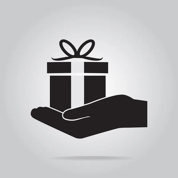 Boîte cadeau dans l'icône de main — Image vectorielle