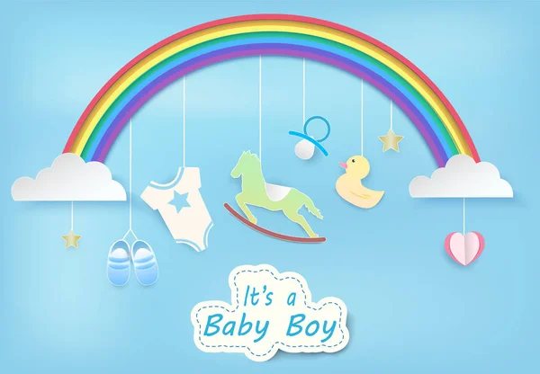 Paper art of rainbow with baby boy shower on blue sky paper cut