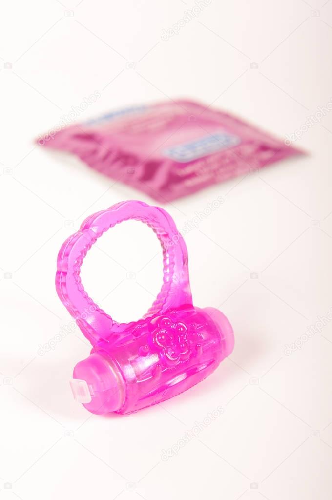 Penis ring and condoms isolated on the white background