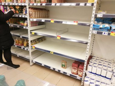 KAUNAS, LITHUANIA - FEBRUARY 29, 2020: Empty shelves in a Maxima supermarket. Shortages of products and oats supplies during panic of Corona virus.