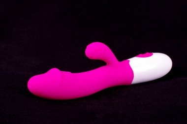 Pink color dildo vibrator. Adult sex toy with G-spot simulation