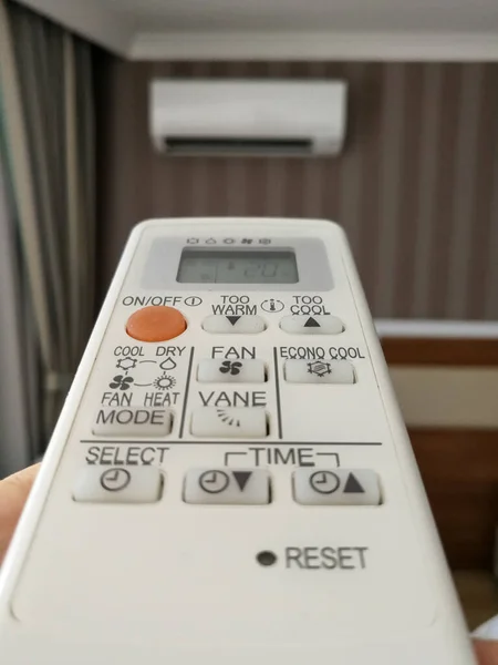 Remote control setting temperature for air conditioner on the wall