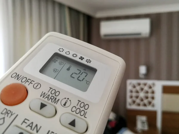 Remote control setting temperature for air conditioner on the wall
