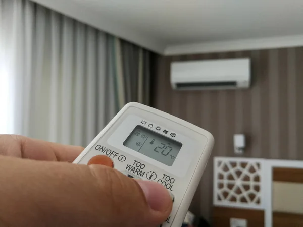 Remote control setting temperature for air conditioner on the wall