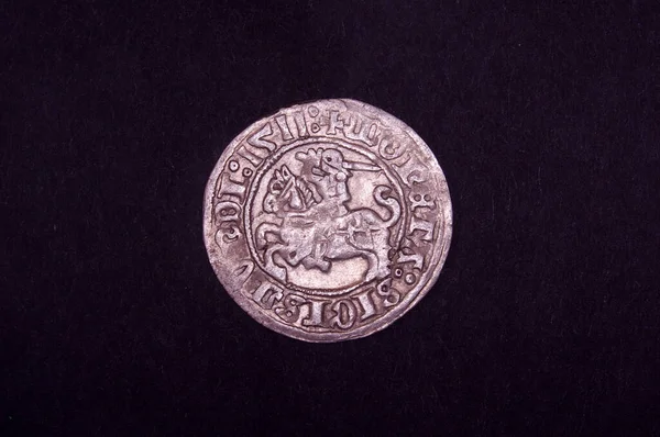 Old Grand Duchy of Lithuania copper coin half-grosz (pusgrasis) isolated on the black background