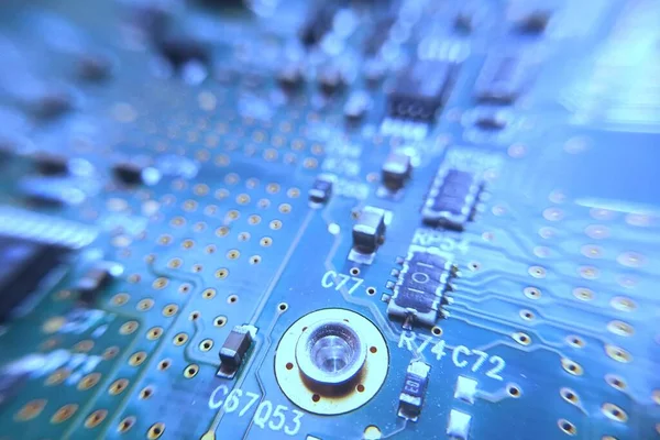 Closeup blue computer PCB board. Macro picture of green printed circuit board - PCB.