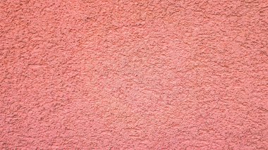 Pembe soyut çimento arka planı. Pembe renkli boş beton duvar.