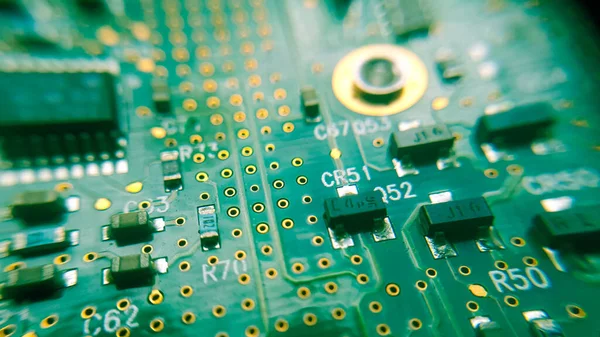Closeup of green electronic circuit board or PCB printed circuit board