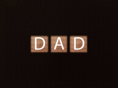 Siyah arkaplandaki tahta bloklara yazılan Baba. Tahta küp üzerine harf metni.