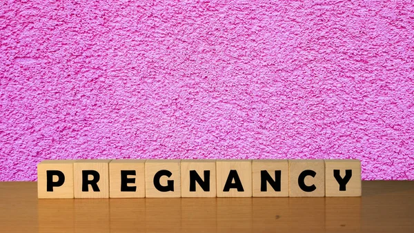 Pregnancy Message Word Wooden Desk Cube Blocks Pink Backgroun — Stock Photo, Image