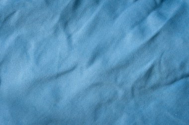 Yakın çekim mavi tekstil dokusu. Kumaş malzeme arka planı. Mavi moda modeli.