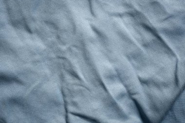 Yakın çekim mavi tekstil dokusu. Kumaş malzeme arka planı. Mavi moda modeli.