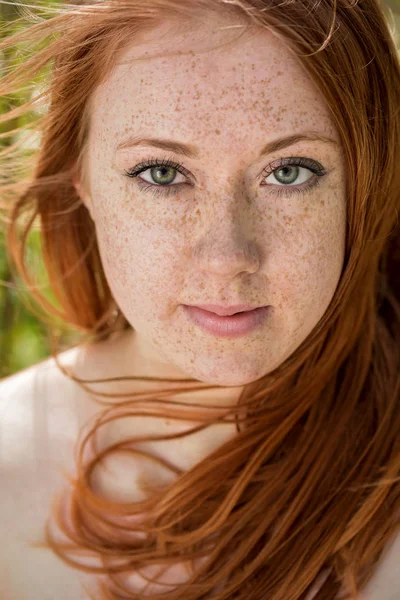 Portrait of a freckled redhead girl — Stock Photo, Image