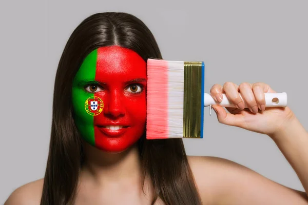 The face of a woman in the national colors of Portugal — Stock Photo, Image