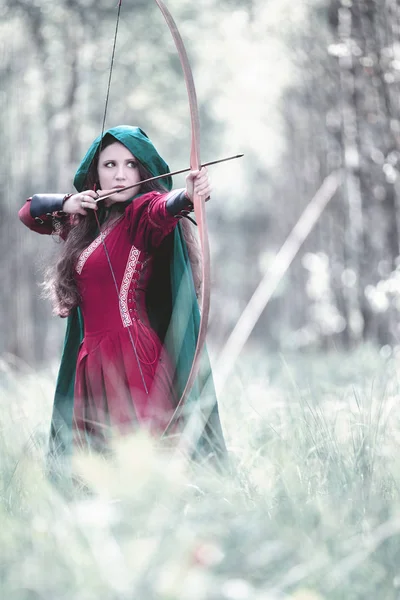An elf archer with a bow in the woods — Stock Photo, Image
