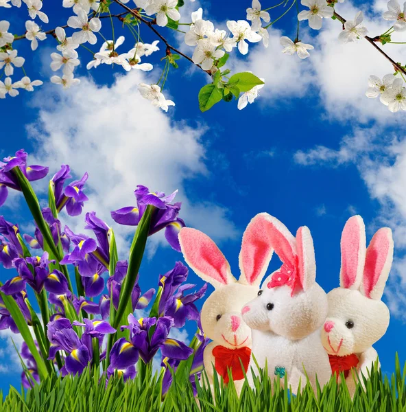 Image of flowers and toy hares close-up — Stock Photo, Image